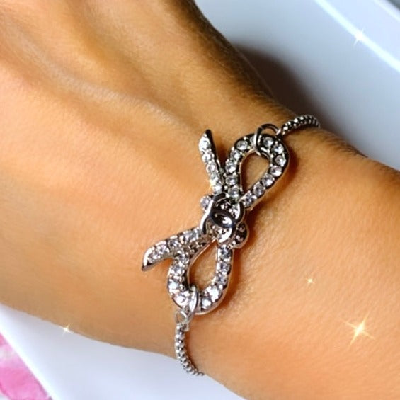 The Crystal Bow Bracelet In Silver-One Size Fits All