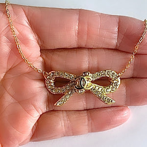 The Crystal Bow Necklace in Gold